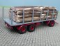 Preview: 1/87 Brekina 3achs Rungenanhänger grau mit Baumstämmen