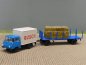 Preview: 1/87 Brekina Robur 2501 Circus Busch mit Rungenanhänger+Heuballen 30612