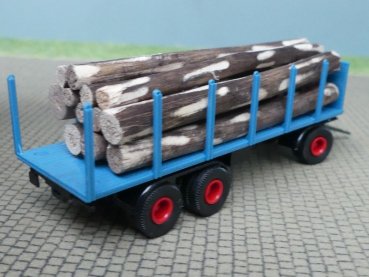 Preview: 1/87 Brekina 3achs Rungenanhänger azurblau mit Baumstämmen