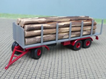 1/87 Brekina 3achs Rungenanhänger grau mit Baumstämmen