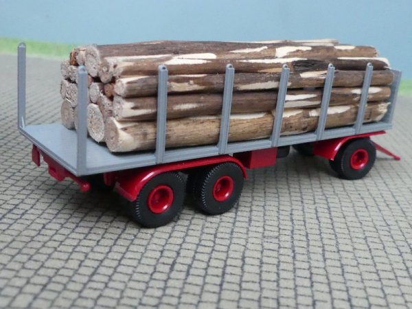 1/87 Brekina 3achs Rungenanhänger grau mit Baumstämmen