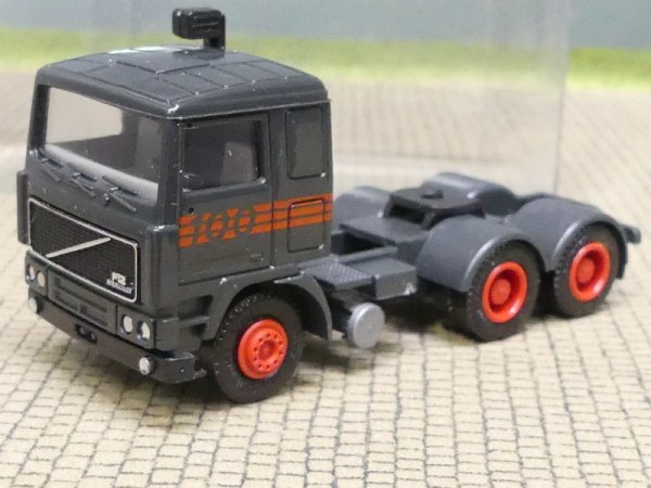 1/87 Herpa Volvo F12 Intercooler 3achs Zugmaschine "100" dunkelgrau in Klarsichtbox