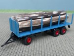 1/87 Brekina 3achs Rungenanhänger azurblau mit Baumstämmen